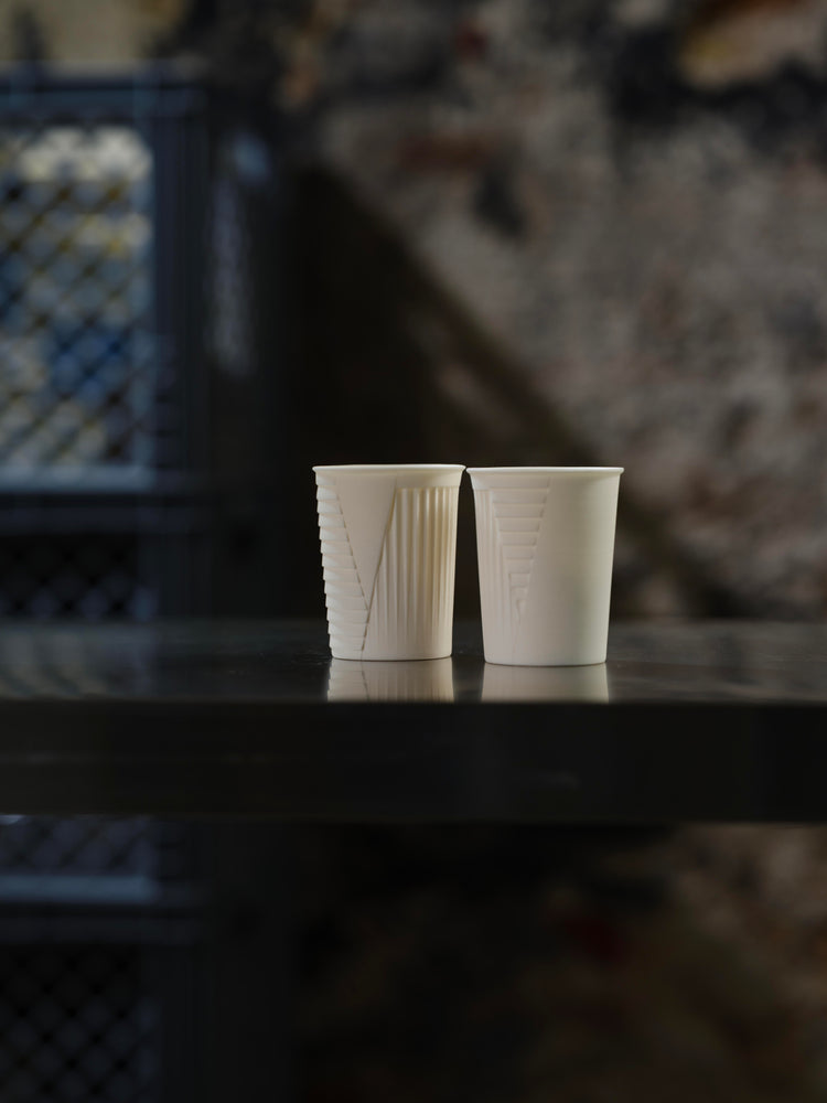 ceramic cup . ander signature . unglazed