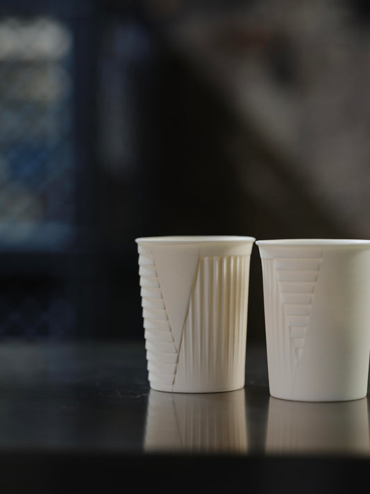 ceramic cup . ander signature . unglazed