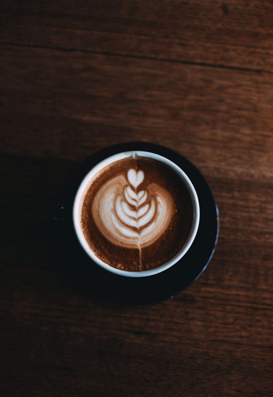 cup chocolate shot latté prepared with steam pipe espresso machine