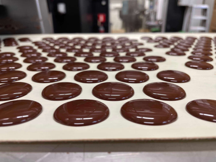 Drops chocolates for snacking on production line